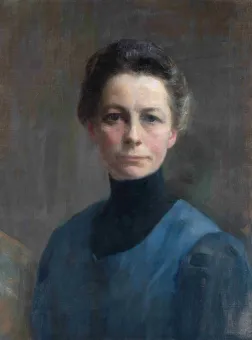 Selbstporträt der Künstlerin Ivana Kobilca mit selbstbewussten, direkten Blick und konzentriertem, ernstem Gesichtsausdruck, ein blaues Kleid mit hohem Kragen tragend