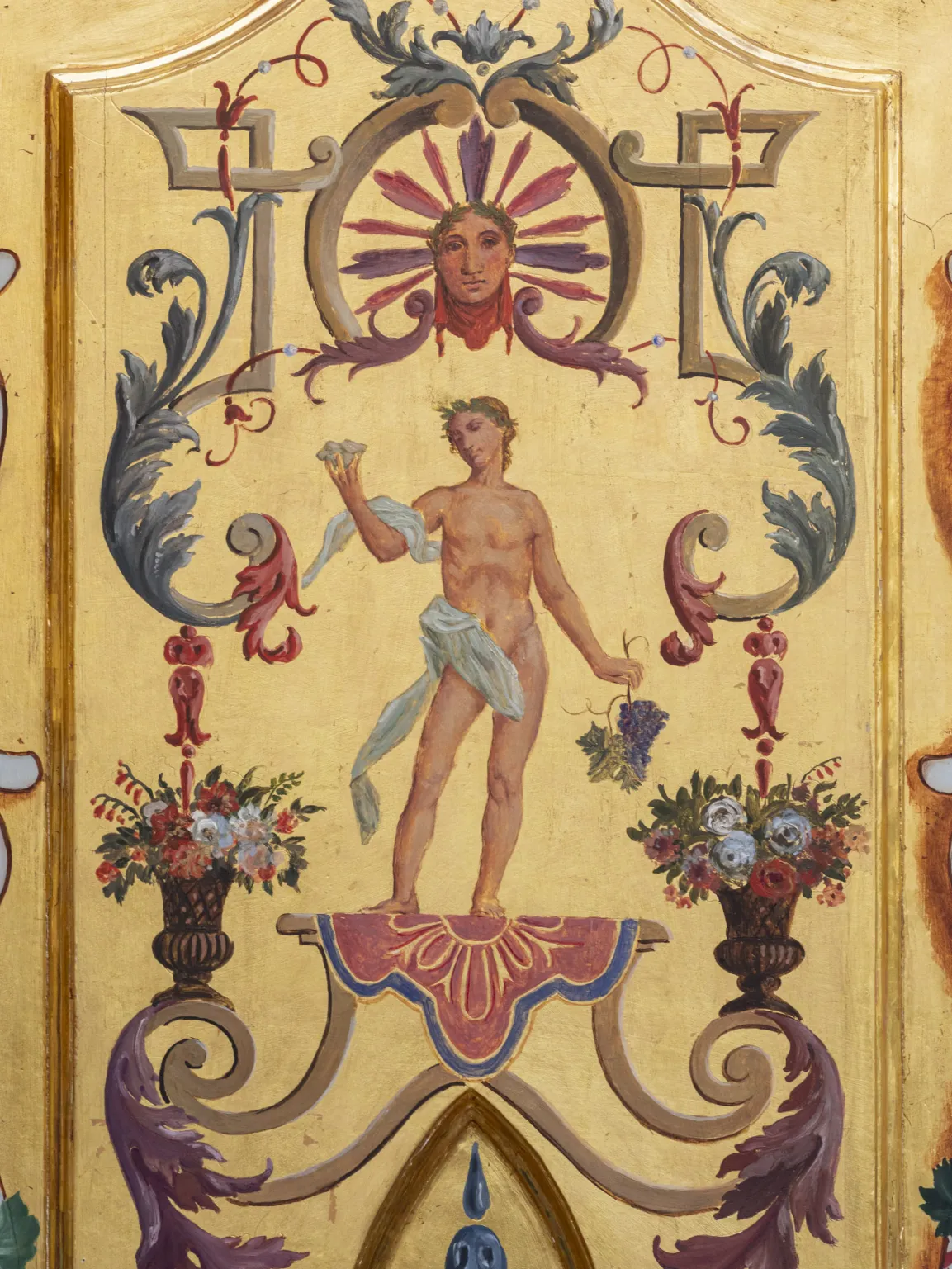 Painting on a gold ground: Personification of Autumn. The god Bacchus appears here as a young, slender man holding grapes in his hand.