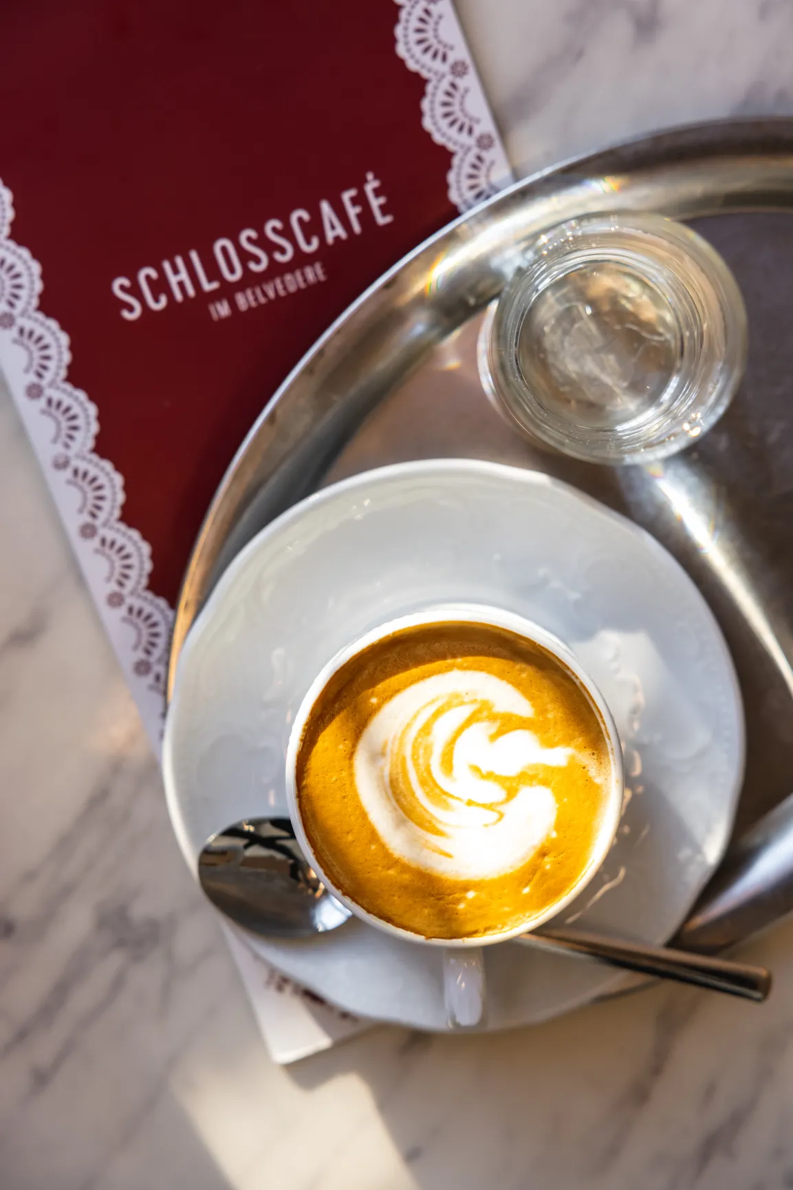 A cup of cappuccino seen from above.